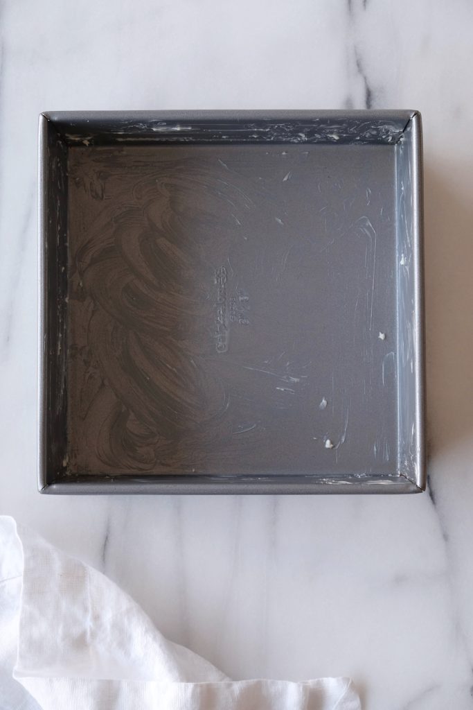 Square baking pan greased with butter