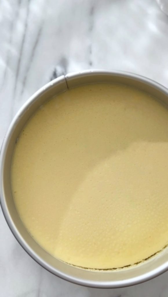 Springform pan with cheesecake, freshly baked