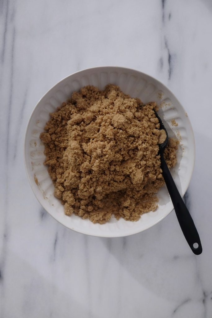 Bowl with ground graham cracker, brown sugar, salt, melted butter; mixed with rubber spatula
