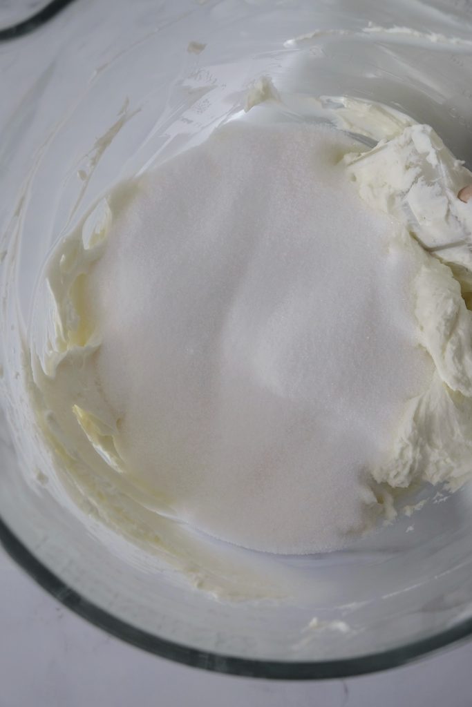 Glass bowl with cream cheese and sugar